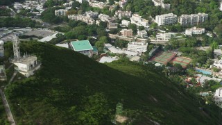 SS01_0076 - 5K stock footage aerial video flyby gondolas and radio towers on hill to reveal Ocean Park on Hong Kong Island, China