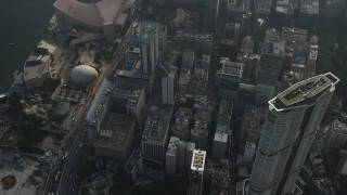 5K stock footage aerial video tilt from skyscraper to reveal waterfront concert hall and museum in Kowloon, Hong Kong Aerial Stock Footage | SS01_0091