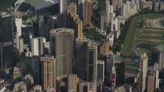 5K stock footage aerial video reverse view of Times Square Towers and reveal race track on Hong Kong Island, China Aerial Stock Footage | SS01_0100