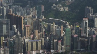 SS01_0103 - 5K stock footage aerial video fly away from skyscrapers with brand name billboards on rooftops on Hong Kong Island, China