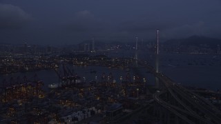 SS01_0114 - 5K stock footage aerial video of flying over the Port of Hong Kong to approach the Stonecutters Bridge at night, China