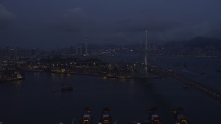 5K stock footage aerial video of flying by Stonecutters Bridge to approach part of the Port of Hong Kong at night in China Aerial Stock Footage | SS01_0116