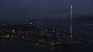 5K stock footage aerial video approach the shore of the Port of Hong Kong at night, China Aerial Stock Footage | SS01_0118