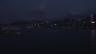 5K stock footage aerial video of approaching Hong Kong Island skyline and the harbor at night, China Aerial Stock Footage | SS01_0127