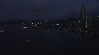 5K stock footage aerial video approach Hong Kong Island skyline from the harbor at nighttime in China Aerial Stock Footage | SS01_0129