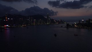 5K stock footage aerial video of Hong Kong Island skyline and Victoria Harbor at night, China Aerial Stock Footage | SS01_0139