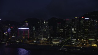 5K stock footage video flyby skyscrapers by the harbor on Hong Kong Island at night, China Aerial Stock Footage | SS01_0151