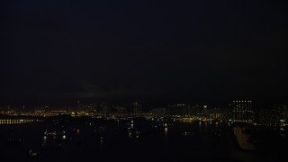 5K stock footage aerial video of lightning flashes over apartment buildings at night in Kowloon, Hong Kong, China Aerial Stock Footage | SS01_0165