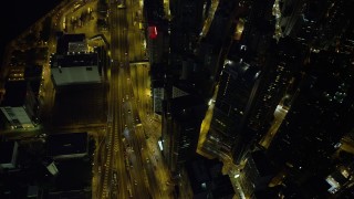 5K stock footage aerial video bird's eye view of a busy street and office towers at night in Hong Kong Island, China Aerial Stock Footage | SS01_0168