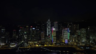 5K stock footage aerial video of tall Hong Kong Island skyscrapers seen from Victoria Harbor at nighttime, China Aerial Stock Footage | SS01_0188