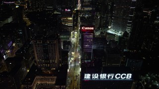 5K stock footage aerial video approach Nathan Road and office buildings at night in Kowloon, Hong Kong, China Aerial Stock Footage | SS01_0191