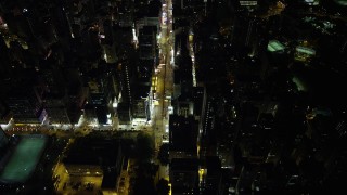 5K stock footage aerial video of flying over Nathan Road past office buildings at Night in Kowloon, Hong Kong, China Aerial Stock Footage | SS01_0194