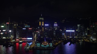 SS01_0203 - 5K stock footage aerial video of approaching convention center and Central Plaza from harbor at night on Hong Kong Island, China