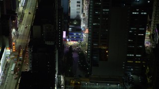 5K stock footage aerial video of a slow approach to corner shop at night in Kowloon, Hong Kong, China Aerial Stock Footage | SS01_0207