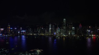 5K stock footage aerial video approach Hong Kong Island skyline from Kowloon at night, China Aerial Stock Footage | SS01_0216