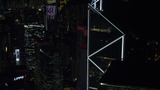 5K stock footage aerial video orbit Bank of China Tower to reveal a pair of high-rises at night on Hong Kong Island, China Aerial Stock Footage | SS01_0227