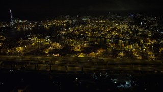 5K stock footage aerial video approach and fly over containers and cranes at the Port of Hong Kong at night, China Aerial Stock Footage | SS01_0232