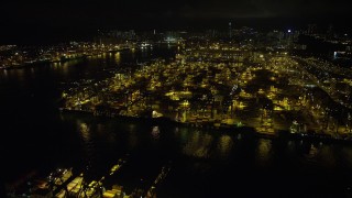 5K stock footage aerial video fly over cargo ships and cranes at the Port of Hong Kong at night, China Aerial Stock Footage | SS01_0233