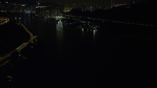 5K stock footage aerial video flyby Ting Kau Bridge at night and tilt to reveal piers on the Rambler Channel in Hong Kong, China Aerial Stock Footage | SS01_0249