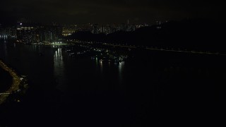 5K stock footage aerial video approach small piers and warehouses on Rambler Channel at night in Hong Kong, China Aerial Stock Footage | SS01_0250