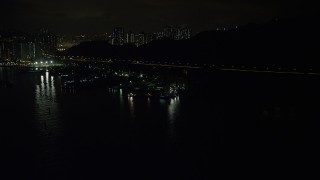 5K stock footage aerial video approach poorly lit piers and warehouses on Rambler Channel at night in Hong Kong, China Aerial Stock Footage | SS01_0251