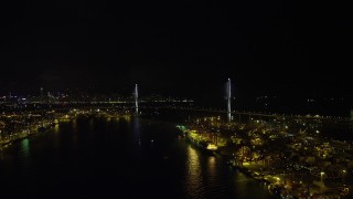 SS01_0263 - 5K stock footage aerial video approach Stonecutters Bridge from Rambler Channel through Port of Hong Kong at night, China