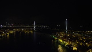 5K stock footage aerial video approach the Stonecutters Bridge at night from Rambler Channel in Hong Kong, China Aerial Stock Footage | SS01_0264