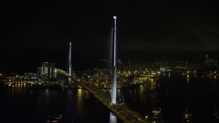 5K stock footage aerial video orbit of the Stonecutters Bridge over Rambler Channel at night in Hong Kong, China Aerial Stock Footage | SS01_0267