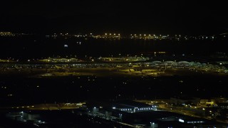 5K stock footage aerial video of airliners and terminals at the Hong Kong International Airport at night, China Aerial Stock Footage | SS01_0278