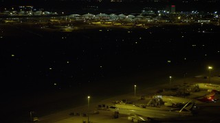 5K stock footage video of airliners parked near taxiway at night at the Hong Kong International Airport, China Aerial Stock Footage | SS01_0281