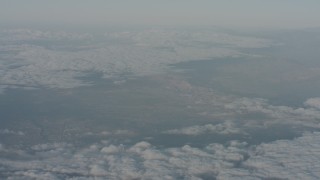 4K stock footage aerial video flyby clouds and a mountain range in Santa Clarita Valley, California Aerial Stock Footage | WA001_018