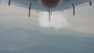 4K stock footage aerial video of reverse view of the underside of the jet and contrail over Los Padres National Forest, California Aerial Stock Footage | WA001_025