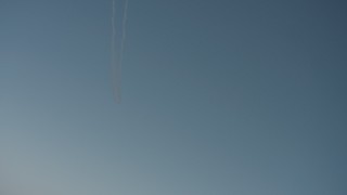 WA001_032 - 4K stock footage aerial video air-to-air view of jet contrails overhead in Solano County, California