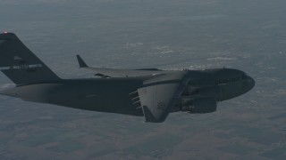 WA001_035 - 4K stock footage aerial video of flying beside a Boeing C-17 over Solano County, California