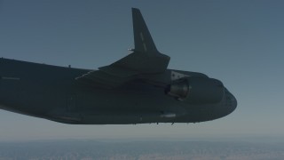 WA001_040 - 4K stock footage aerial video of a view of a Boeing C-17 from under the right wing, Solano County, California