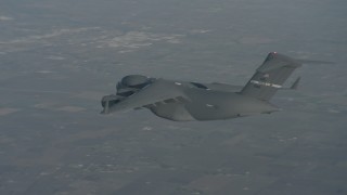 WA001_044 - 4K stock footage aerial video fly around the tail of a Boeing C-17 in flight over Solano County, California