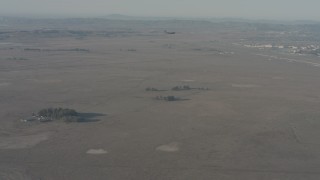 WA001_053 - 4K stock footage aerial video of a Boeing C-17 flying over countryside in Solano County, California