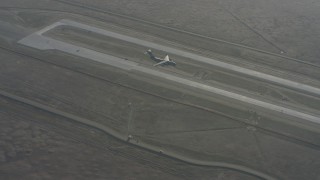 WA001_054 - 4K stock footage aerial video of a Boeing C-17 flying by the runway at Travis Air Force Base, California