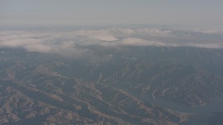 4K stock footage aerial video approach clouds near Castaic Lake in the Sierra Pelona Mountains, California Aerial Stock Footage | WA002_008