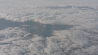 4K stock footage aerial video of a reverse view of clouds and mountain range in Southern California Aerial Stock Footage | WA003_001