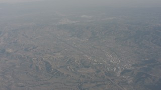 WA003_004 - 4K stock footage aerial video approach suburban homes and hills in Simi Valley, California