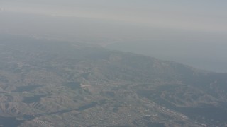 WA003_007 - 4K stock footage aerial video fly over Agoura Hills to approach the Santa Monica Mountains, California