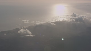 4K stock footage aerial video of the Santa Monica Mountains on the coast and sun reflection on the Pacific Ocean, California Aerial Stock Footage | WA003_011