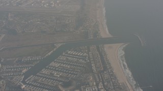 WA003_017 - 4K stock footage aerial video tilt from Venice Beach to reveal Marina del Rey, California