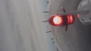 WA004_007 - 4K stock footage aerial video of the underside of a jet flying over dense clouds, Lassen County, California