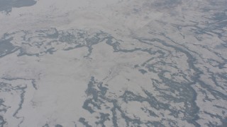 WA004_018 - 4K stock footage aerial video of a bird's eye view of rivers and snow covered hills in Lake County, Oregon