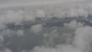 4K stock footage aerial video fly over clouds to reveal Puget Sound, Washington Aerial Stock Footage | WA004_037