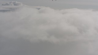 4K stock footage aerial video fly low over clouds above Washington Aerial Stock Footage | WA004_051