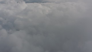 4K stock footage aerial video of flying over a wide expanse of clouds over Washington Aerial Stock Footage | WA004_072