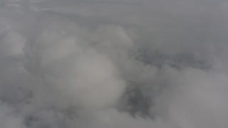 4K stock footage aerial video of flying by clouds over Skamania County, Washington Aerial Stock Footage | WA004_078